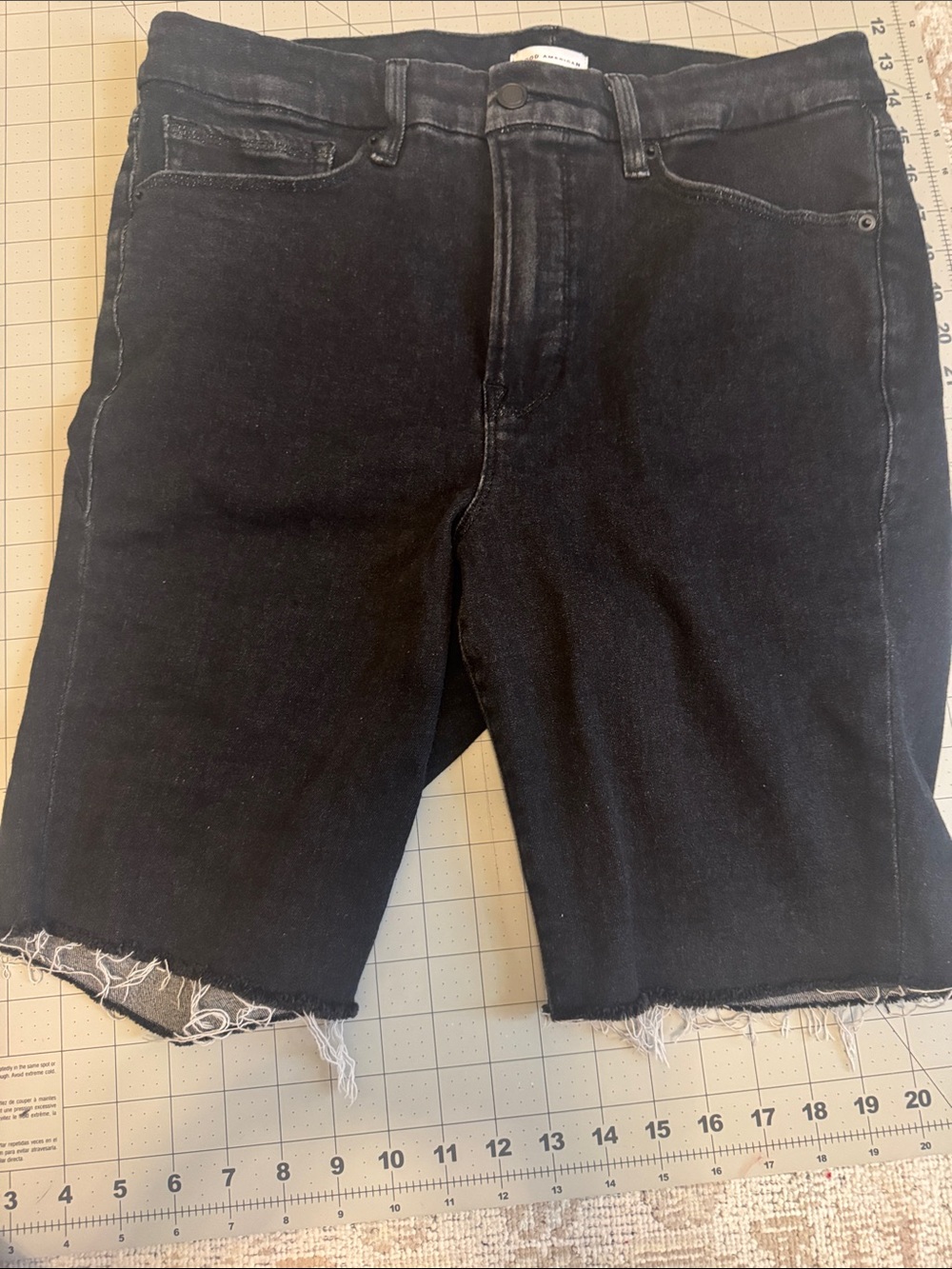 Good American Black Raw Hem Denim Cutoff Shorts